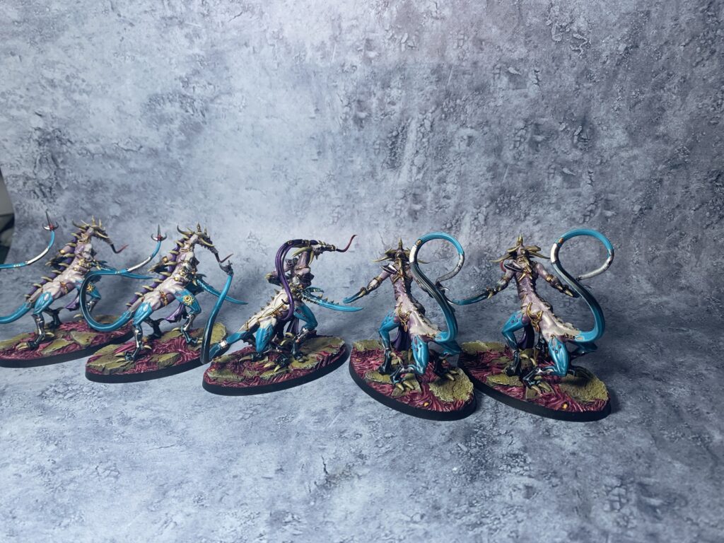 Daemons of Slaanesh in sea blue and pink colours