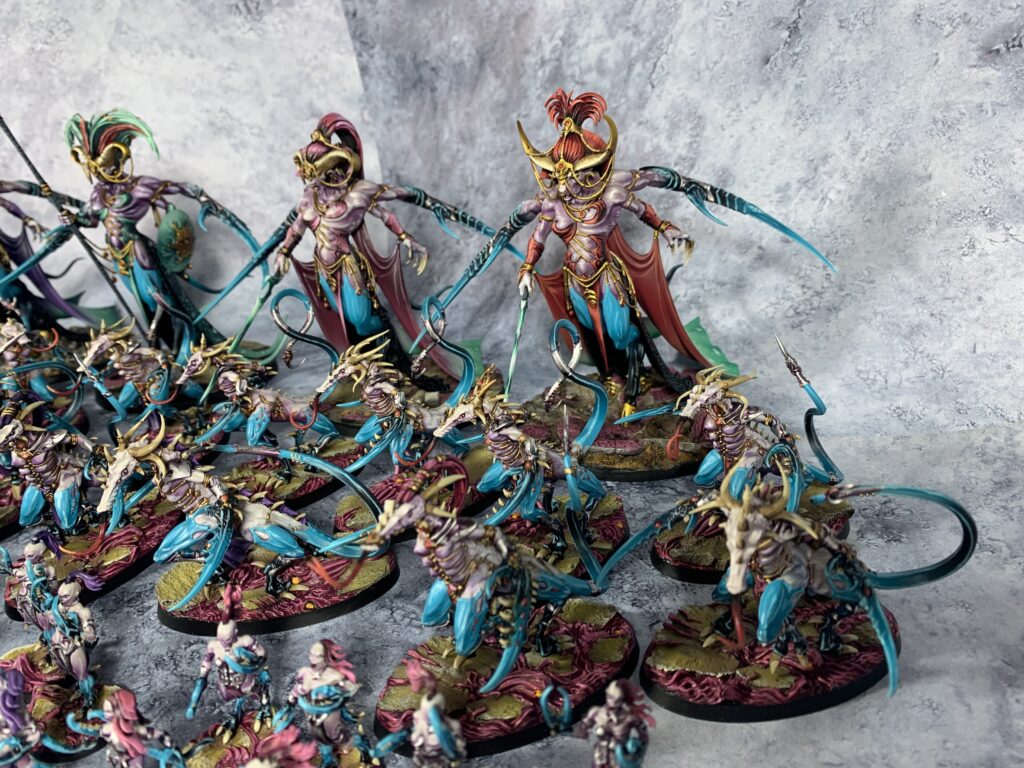 Daemons of Slaanesh in sea blue and pink colours
